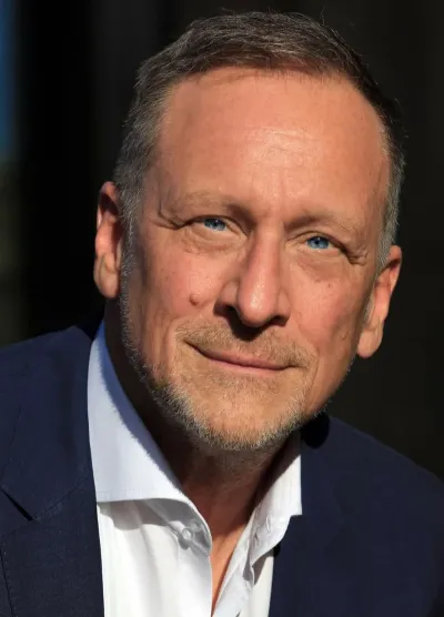 Gunther Wolf als Speaker für Mitarbeitermotivation begeistert Zuhörer Speaker für Mitarbeitermotivation: